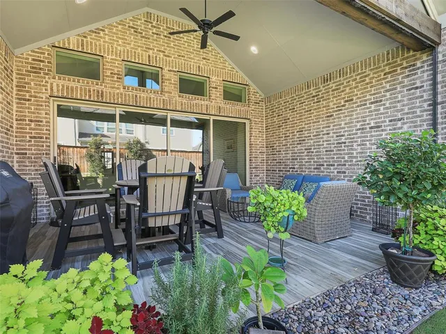 a view of a chairs and table in a patio