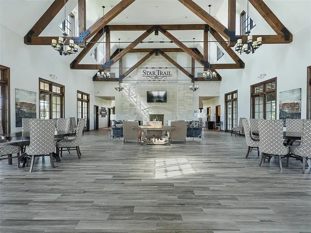 a living room with fireplace furniture and a wooden floor