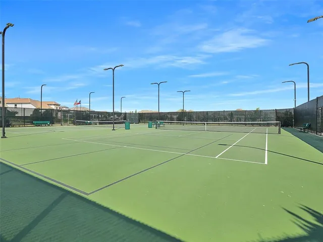 a view of an outdoor space and tennis court