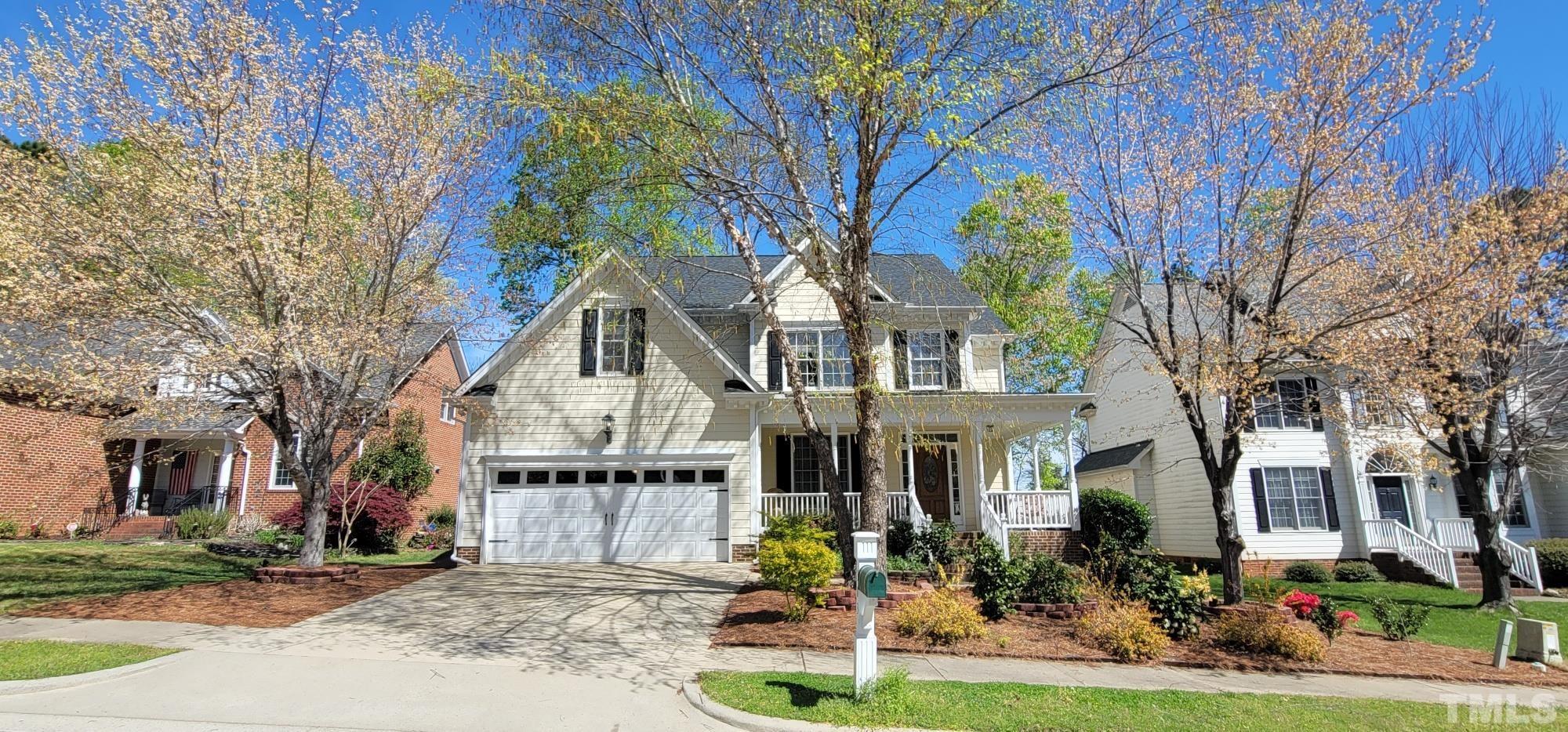 303 Evans Estates Drive Cary, NC 27513 - Photo 1 of 61 a front view of house with yard outdoor seating and green space