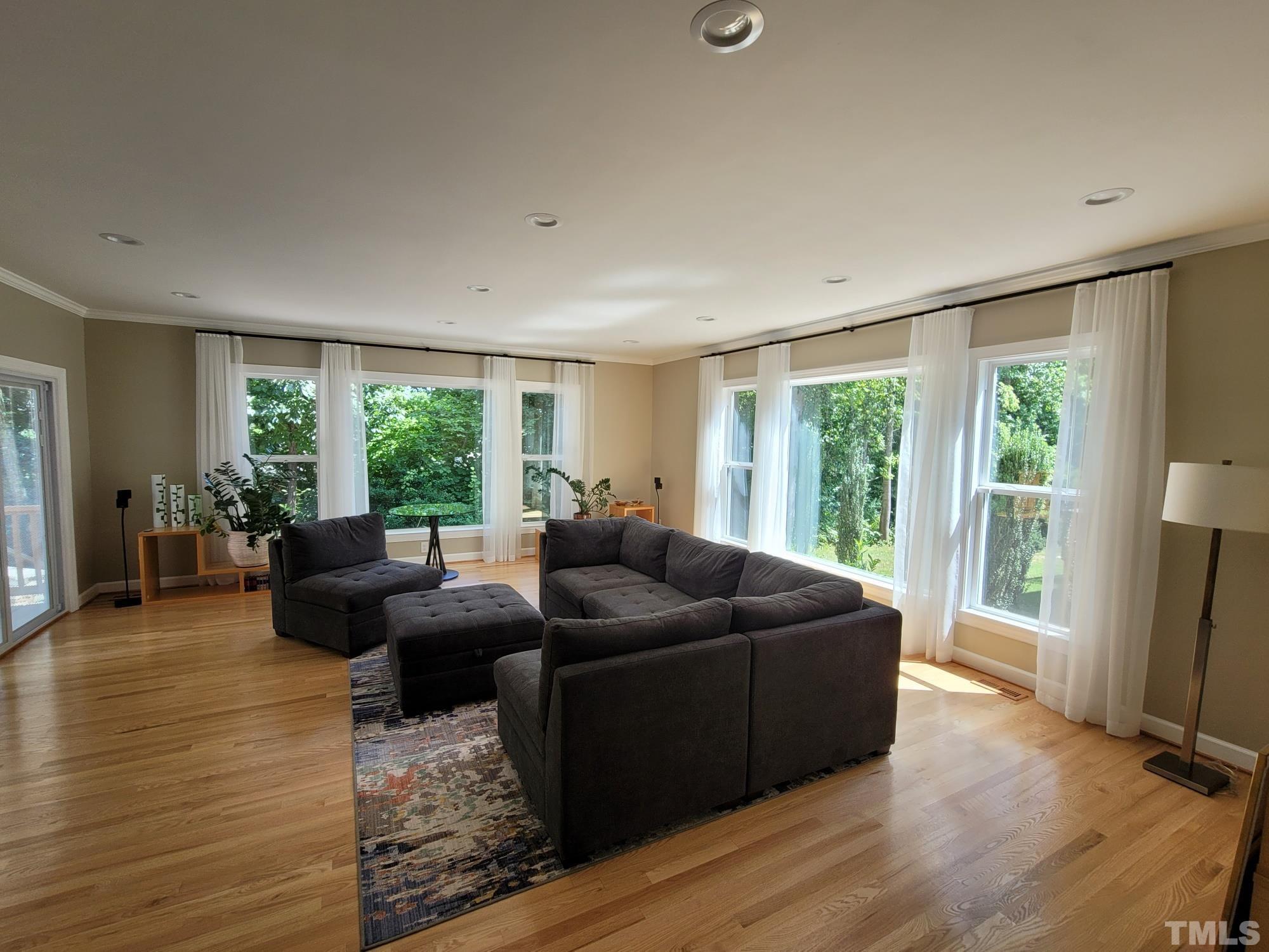 303 Evans Estates Drive Cary, NC 27513 - Photo 2 of 61 a living room with furniture and a large window
