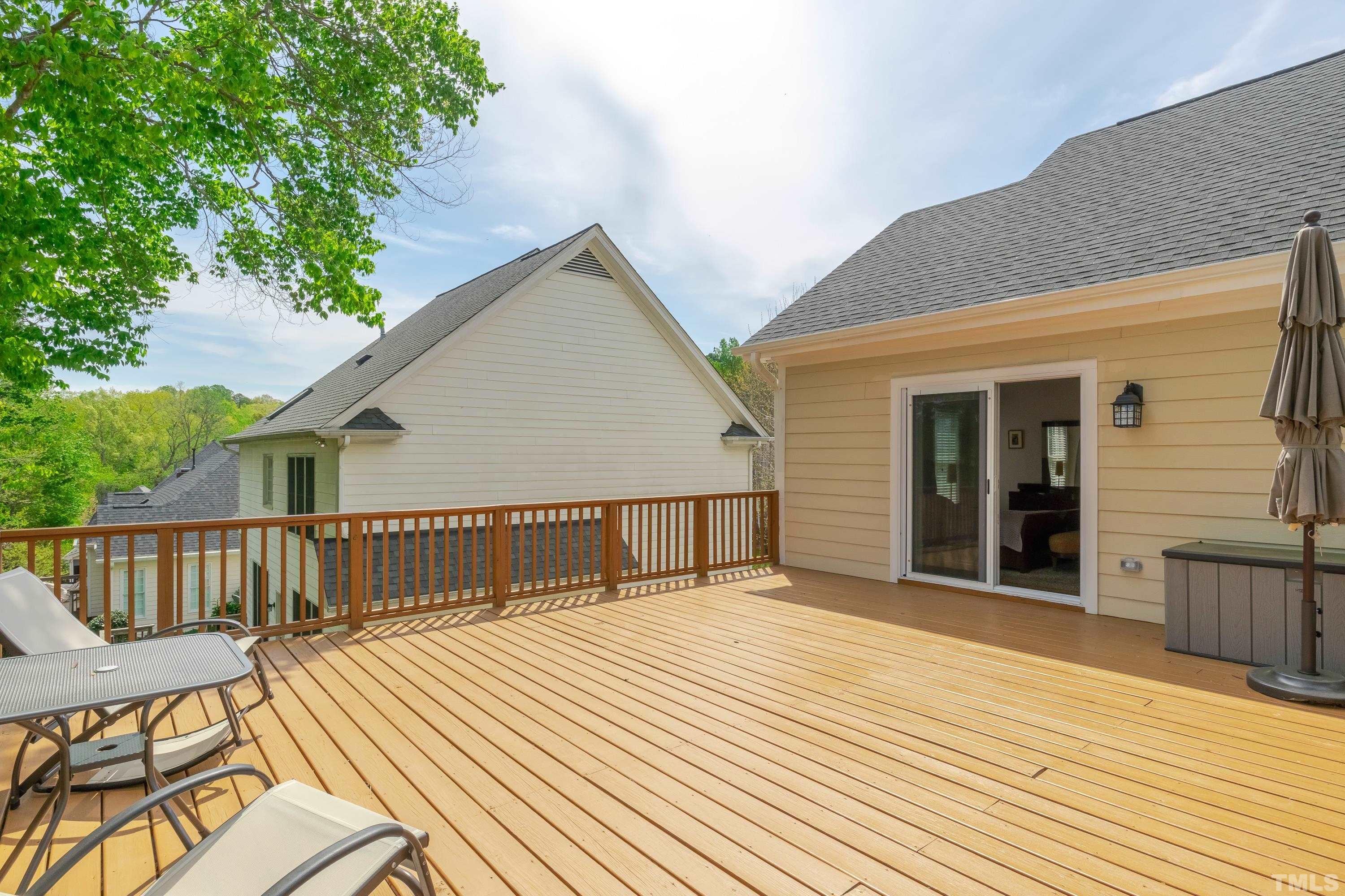 303 Evans Estates Drive Cary, NC 27513 - Photo 24 of 61 a view of a house with wooden deck