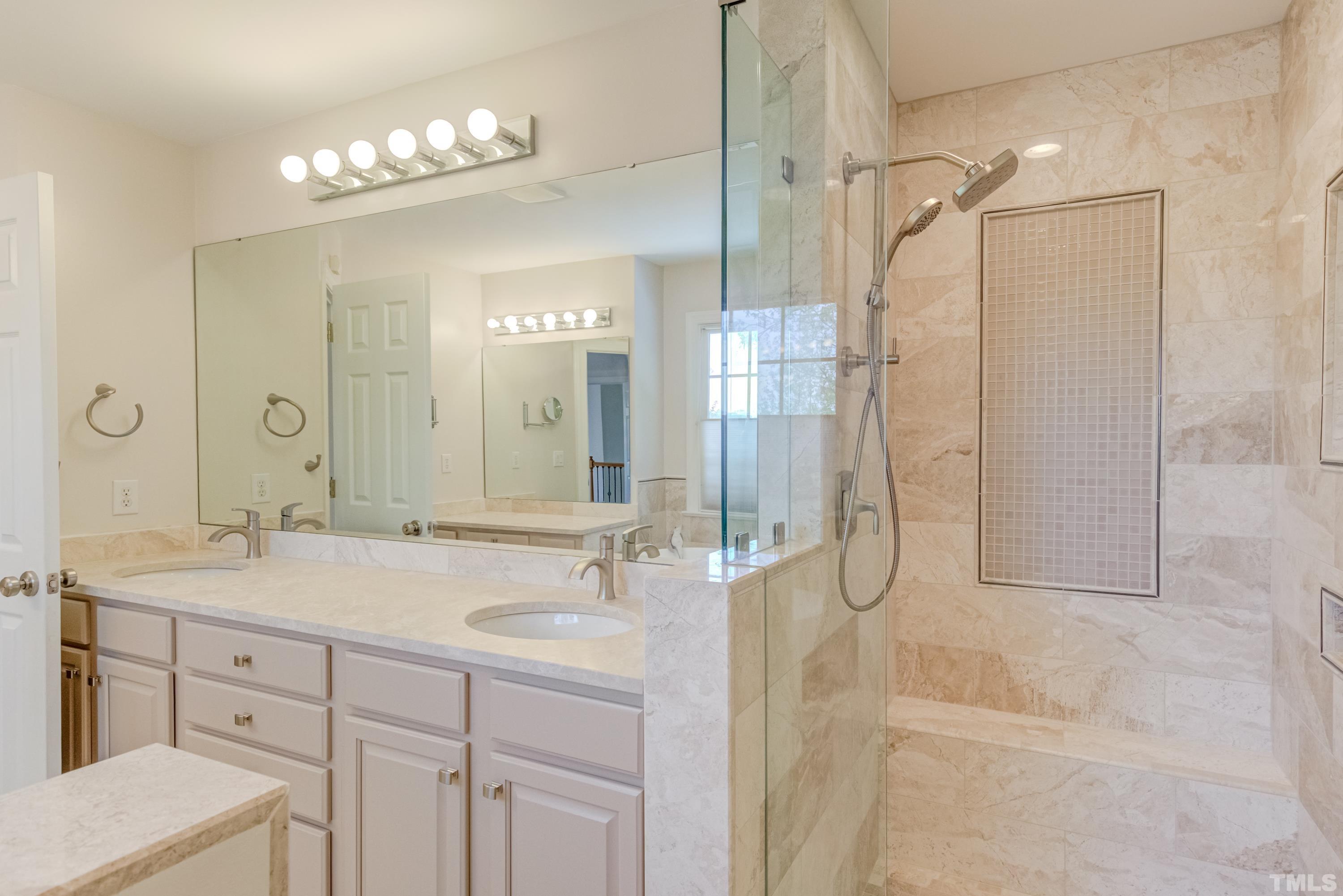 303 Evans Estates Drive Cary, NC 27513 - Photo 38 of 61 a bathroom with a double vanity sink mirror and shower