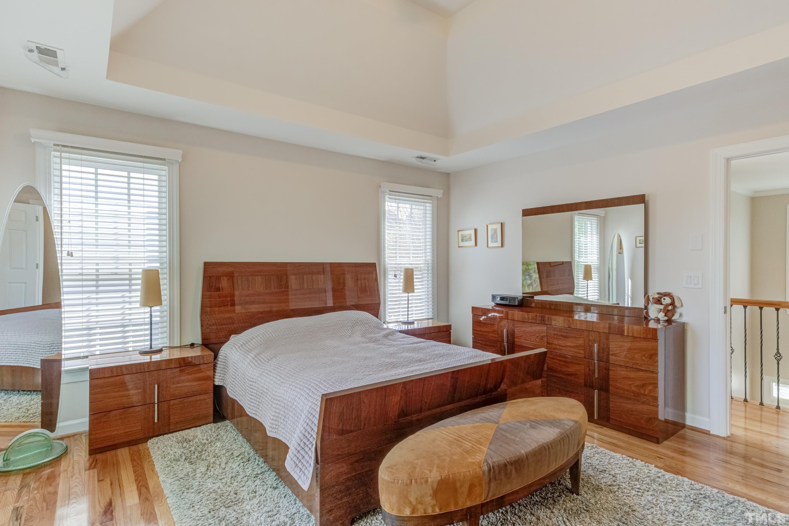 303 Evans Estates Drive Cary, NC 27513 - Photo 42 of 61 a bed room with a bed and a couch