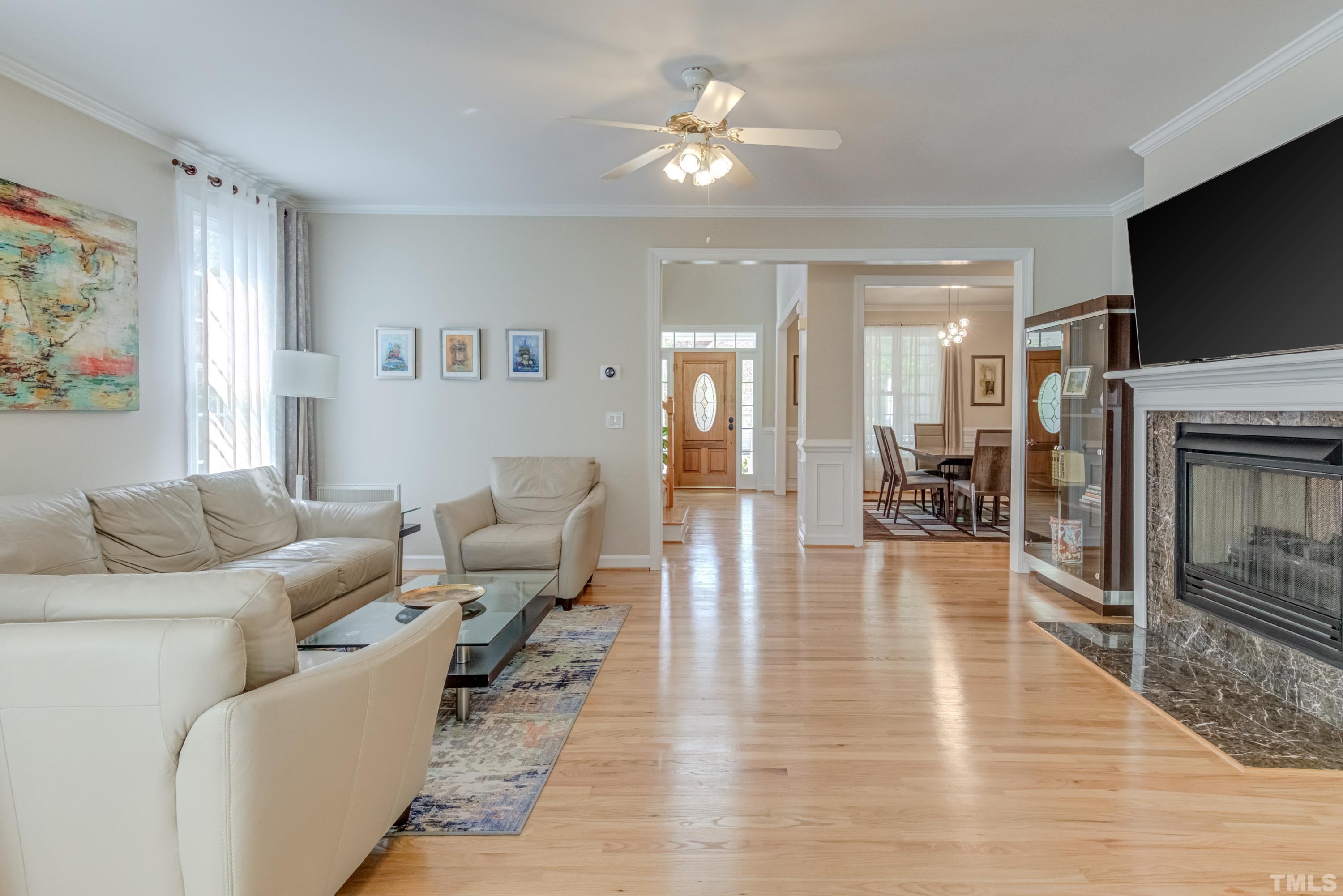 303 Evans Estates Drive Cary, NC 27513 - Photo 59 of 61 a living room with furniture fireplace and flat screen tv