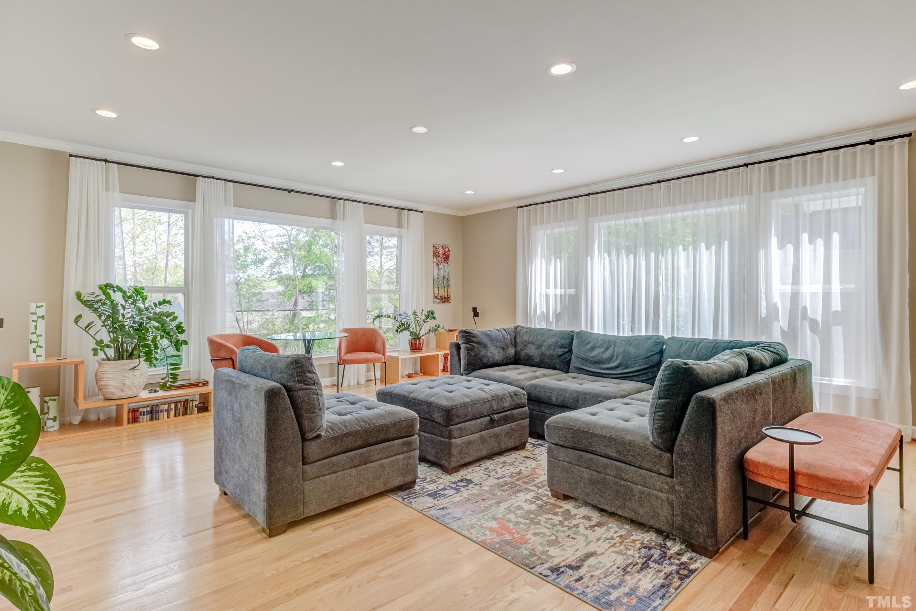 303 Evans Estates Drive Cary, NC 27513 - Photo 60 of 61 a living room with furniture and a large window