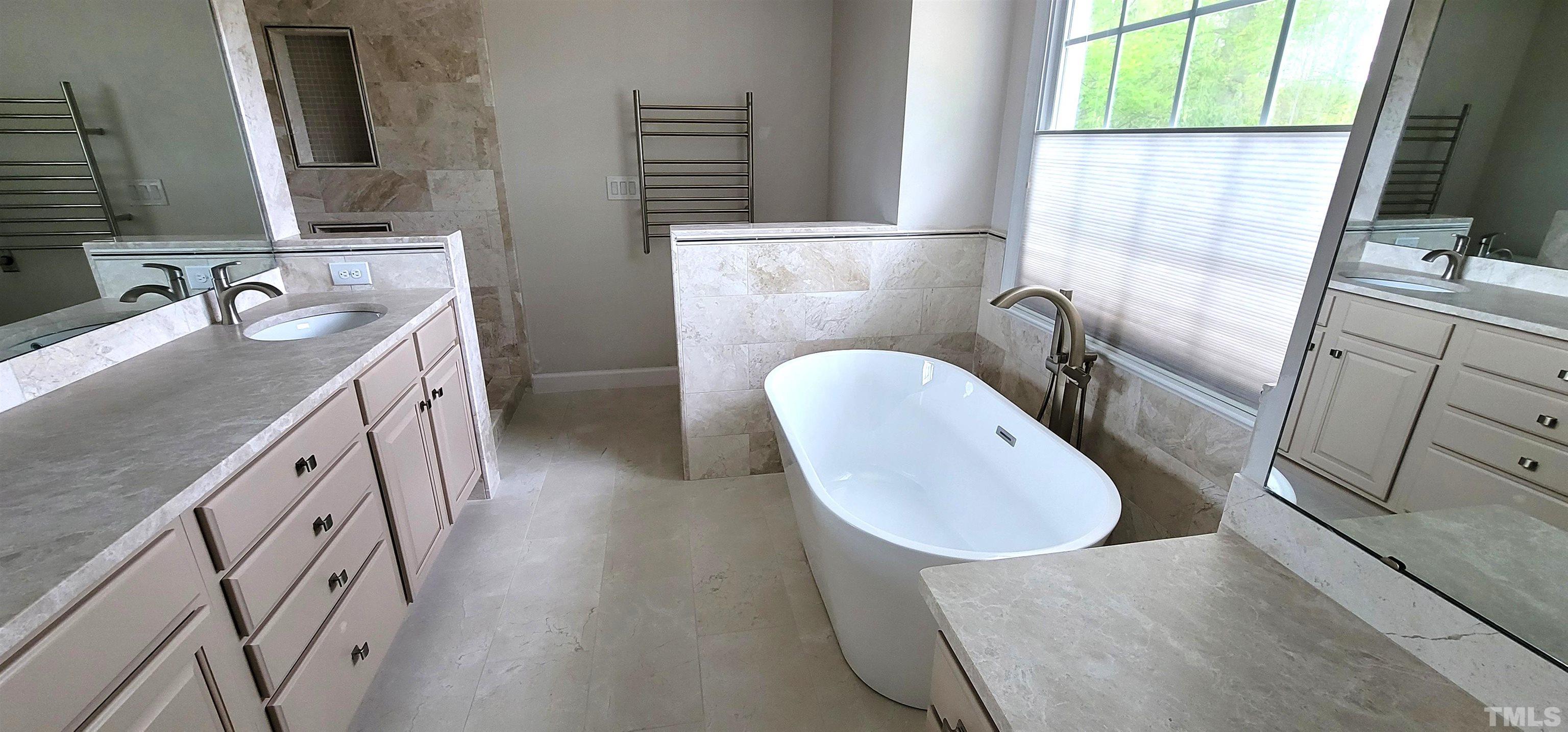 303 Evans Estates Drive Cary, NC 27513 - Photo 7 of 61 a bathroom with sink a mirror a toilet and a window