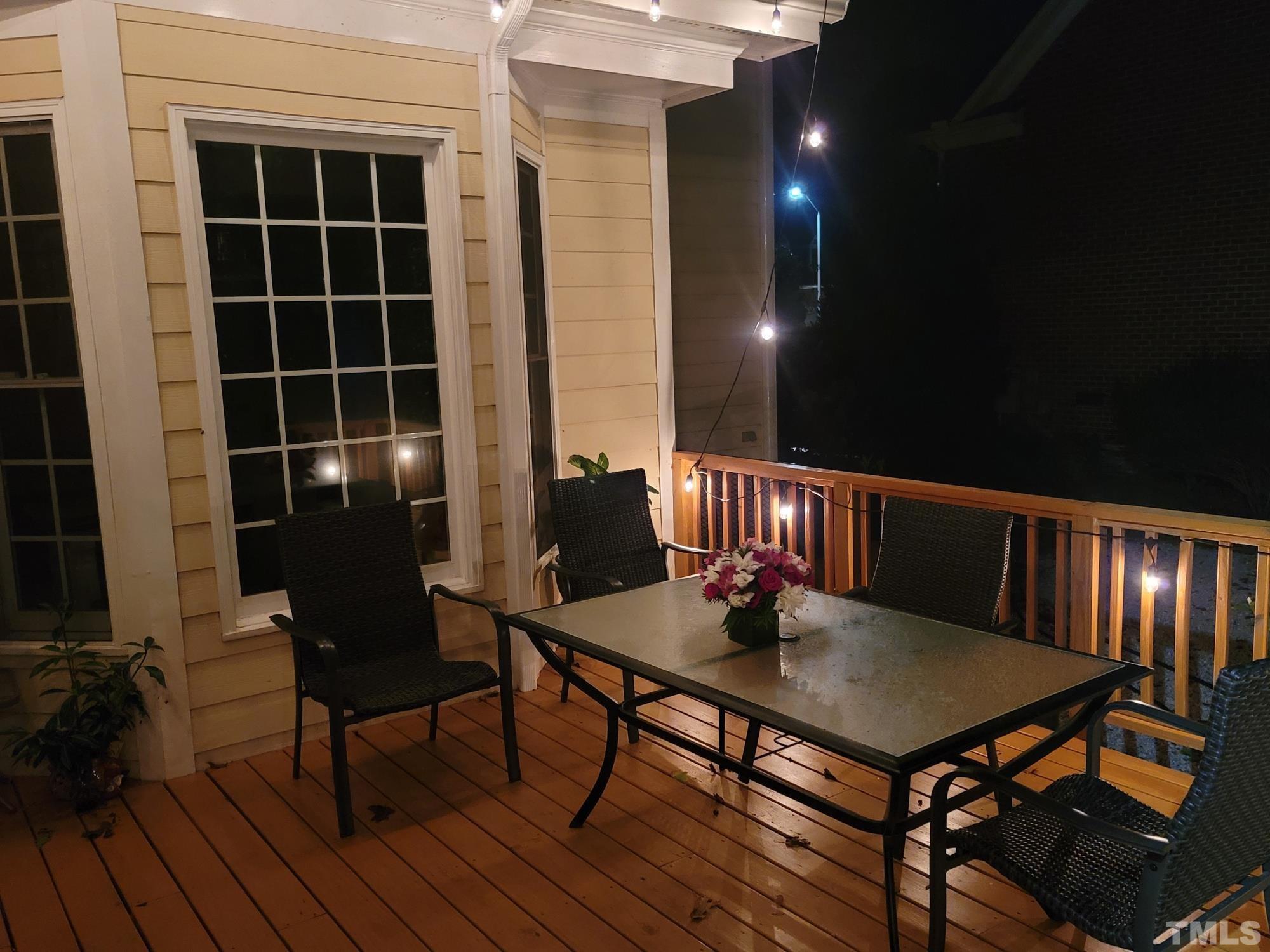 303 Evans Estates Drive Cary, NC 27513 - Photo 8 of 61 a outdoor dining space with furniture and wooden floor