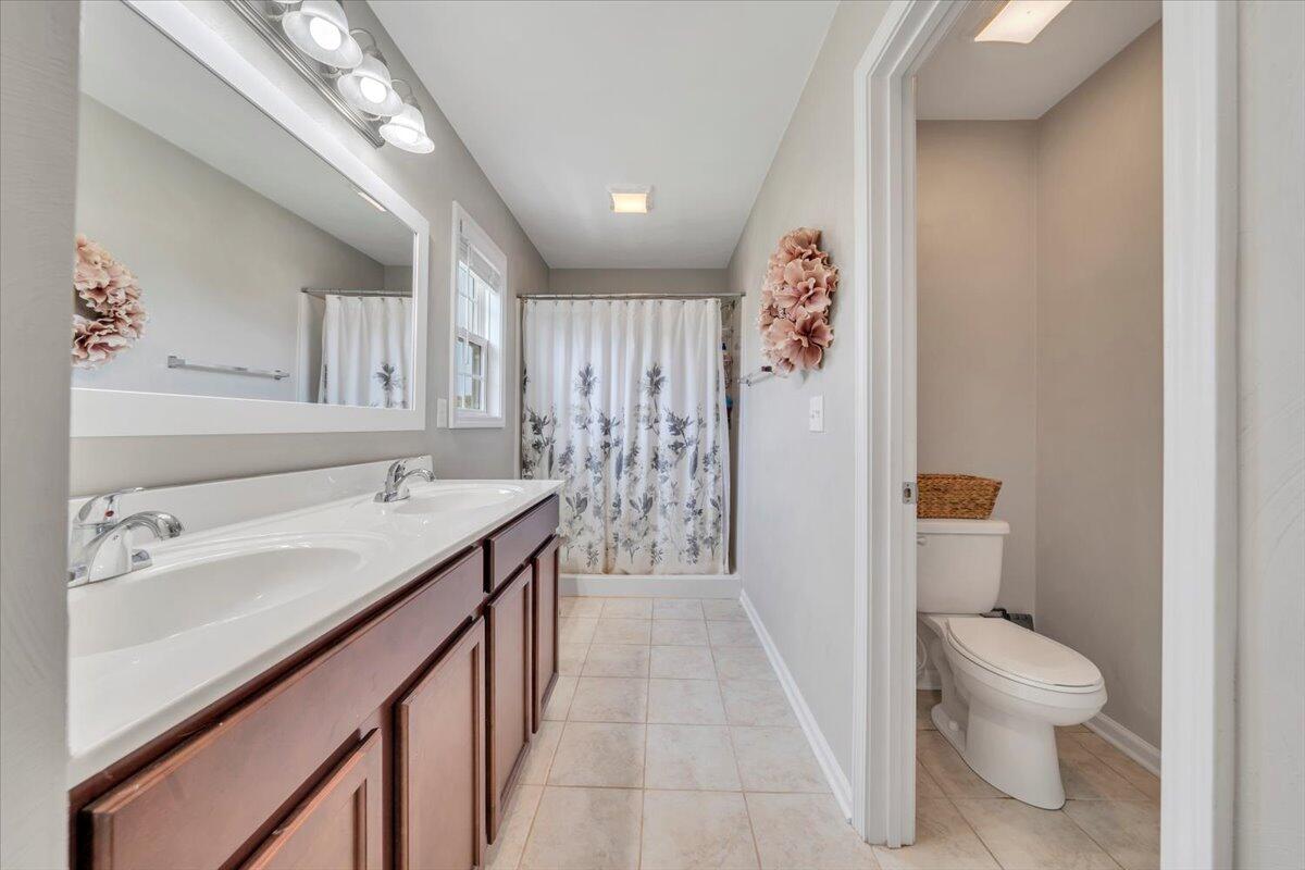 522 Cambridge Ct Road Vinton, VA 24179 - Photo 27 of 43 a spacious bathroom with a sink a toilet and shower