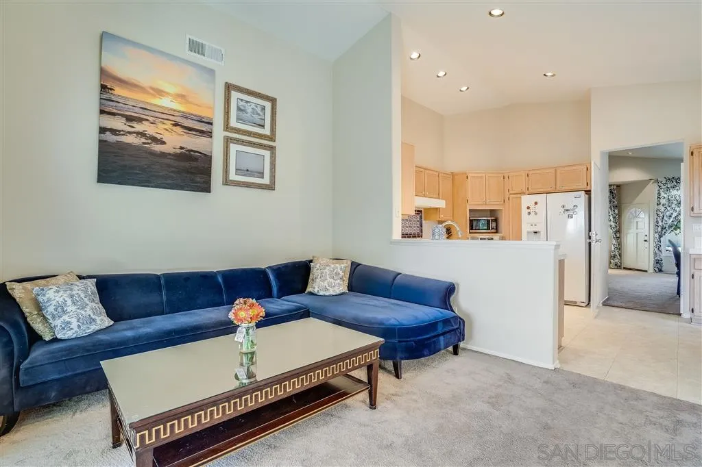 7570 Windy Ridge Road San Diego, CA 92126 - Photo 17 of 25 a living room with furniture and a rug