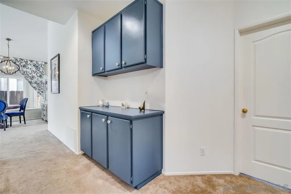 7570 Windy Ridge Road San Diego, CA 92126 - Photo 18 of 25 a view of an empty room with window and wooden floor