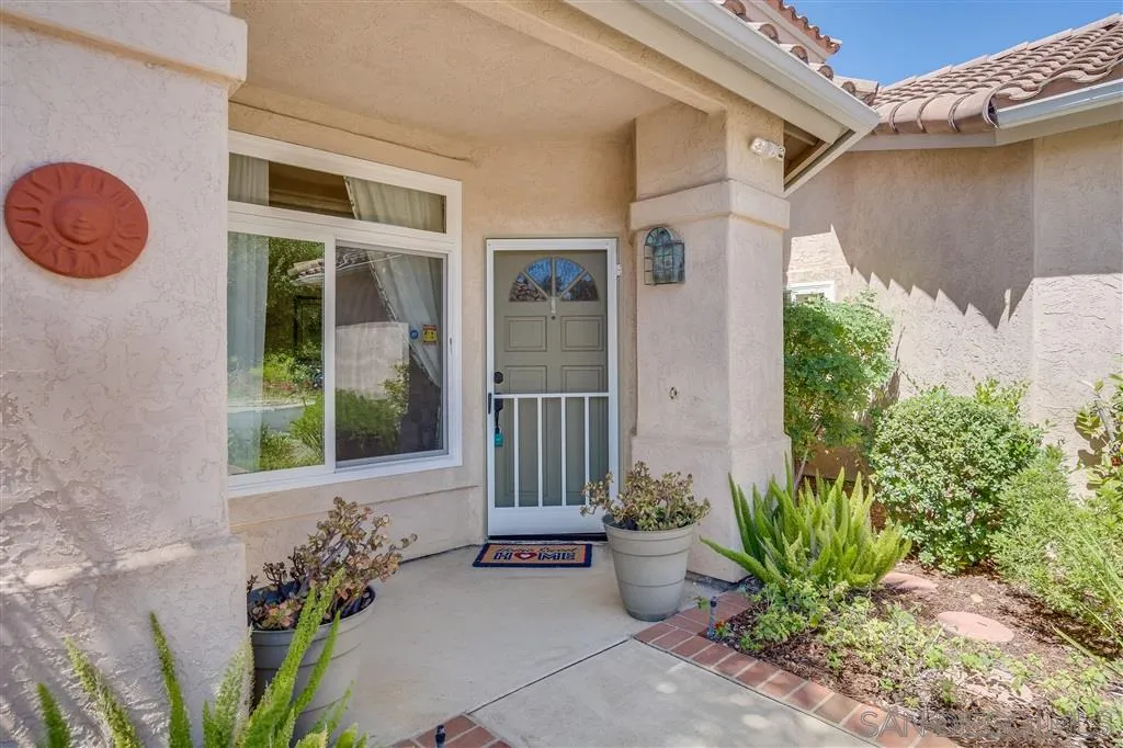 7570 Windy Ridge Road San Diego, CA 92126 - Photo 7 of 25 a front view of a house