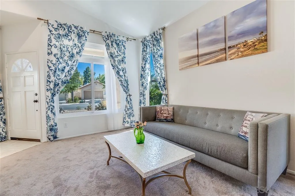 7570 Windy Ridge Road San Diego, CA 92126 - Photo 10 of 25 a living room with furniture and a window