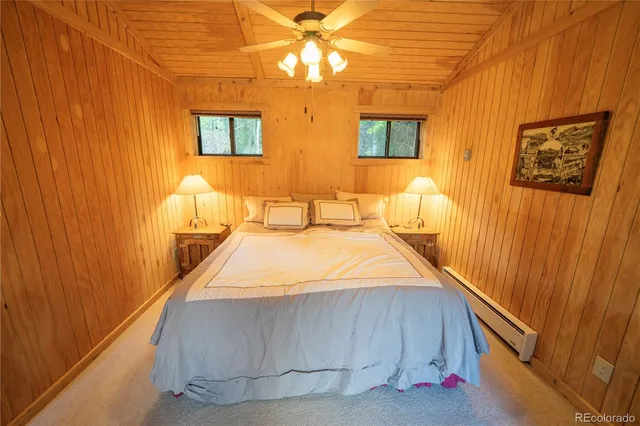 a bed room with a bed and a chandelier