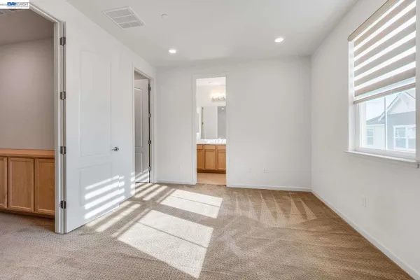 a view of hallway with window and entryway