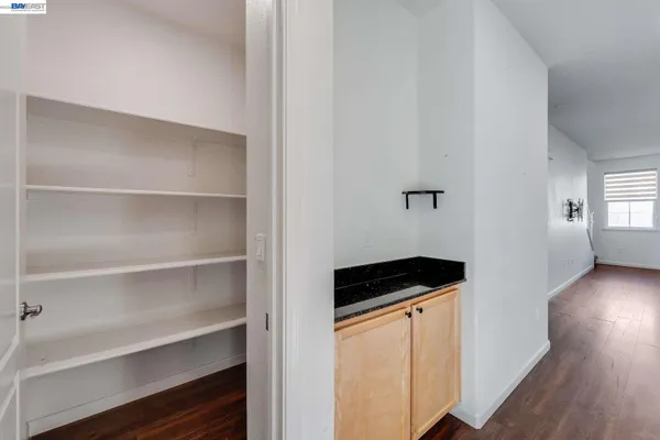 a kitchen with a refrigerator and cabinets