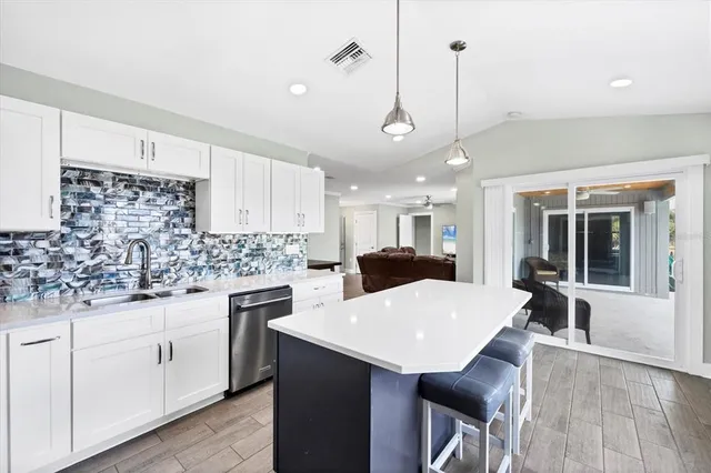 a view of a dining room with furniture and window
