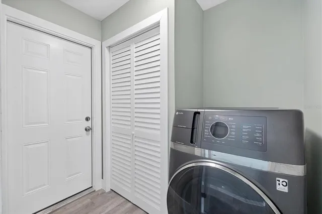 a view of a porch with furniture and a yard