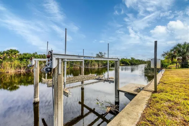 an aerial view of a house with garden space and street view