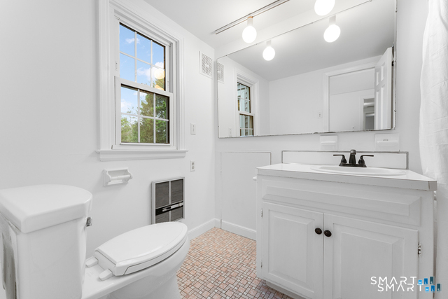 62 Chatham Road Berlin, CT 06037 - Photo 23 of 38 a bathroom with a sink a toilet and mirror