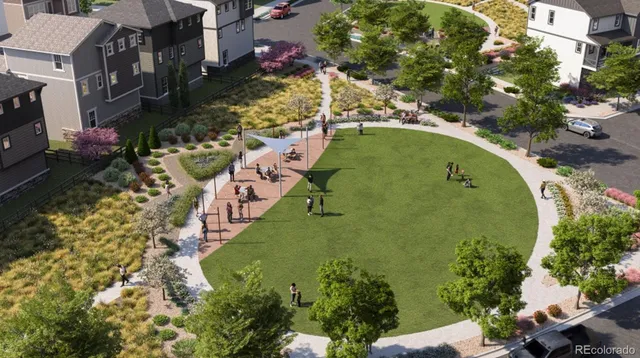 an aerial view of a house with a yard and lake view