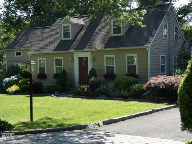 26 Cavray Road West Norwalk, CT 06855 - Photo 1 of 1 a front view of a house with garden
