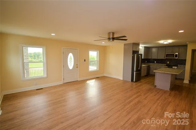 a view of a kitchen with a sink and a stove top oven