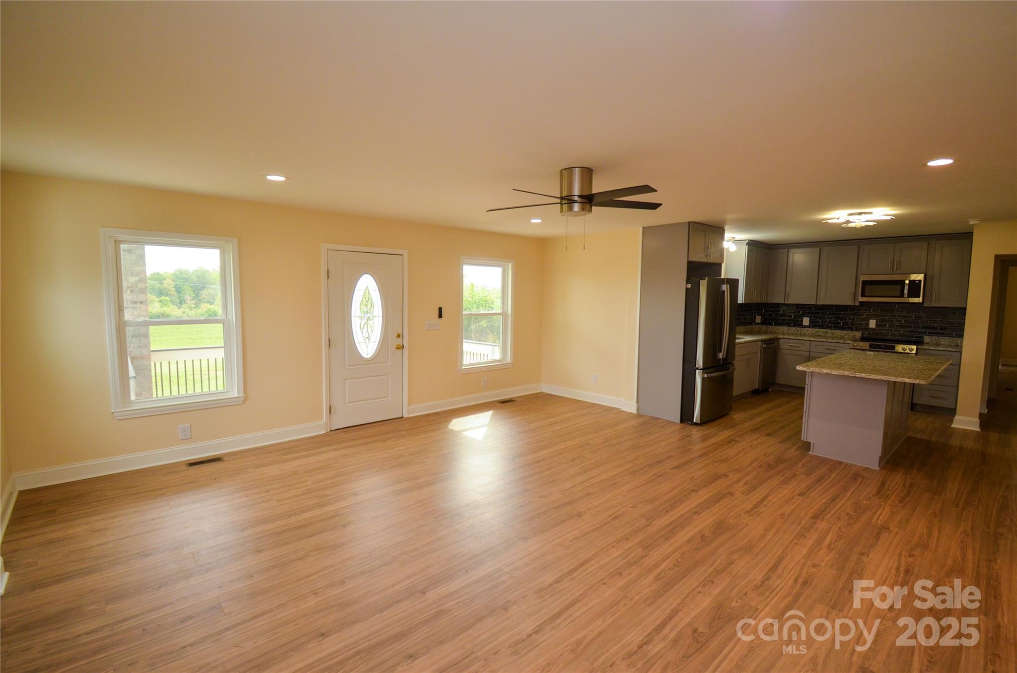 907 Carpenters Grove Church Road Lawndale, NC 28090 - Photo 13 of 33 a view of a kitchen with a sink and a stove top oven
