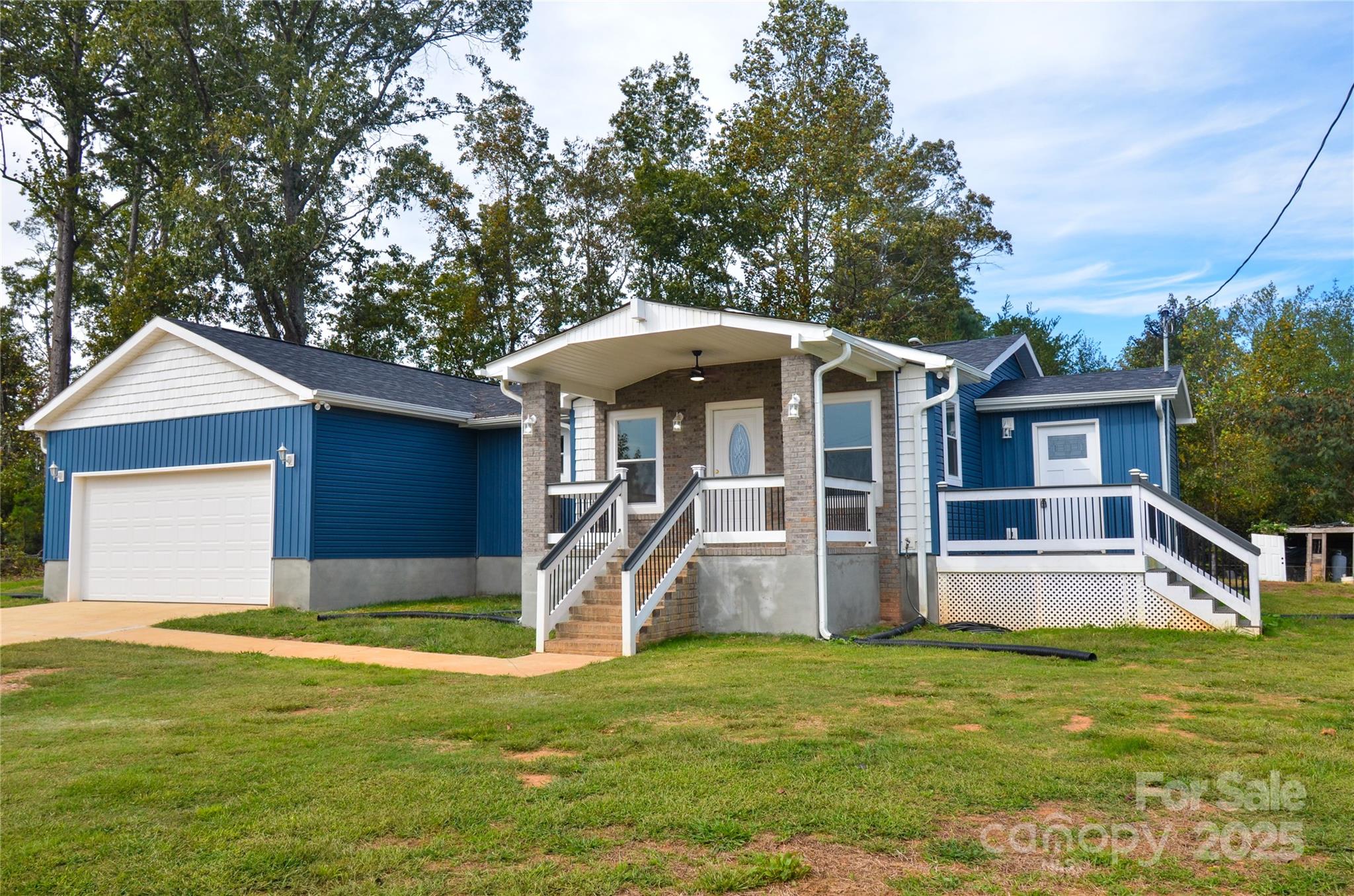 907 Carpenters Grove Church Road Lawndale, NC 28090 - Photo 14 of 33 a front view of house with yard and garage