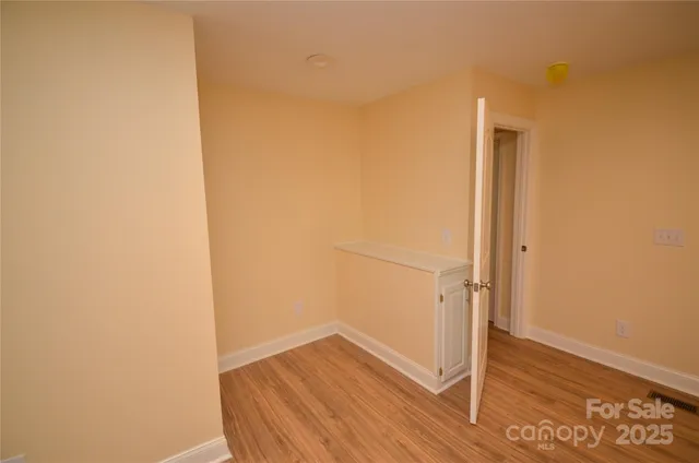 a view of front door with wooden floor