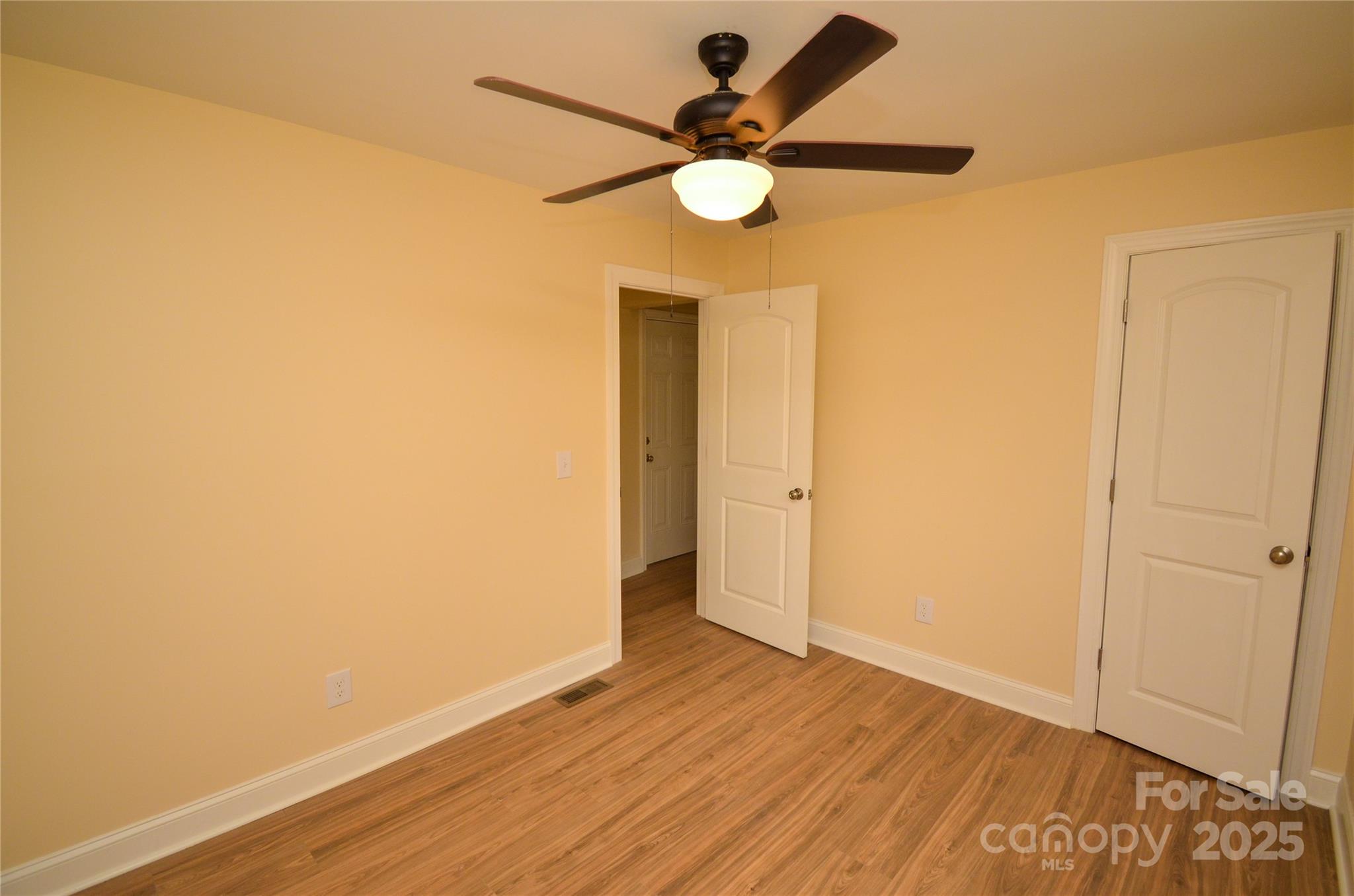 907 Carpenters Grove Church Road Lawndale, NC 28090 - Photo 25 of 33 a view of an empty room with wooden floor