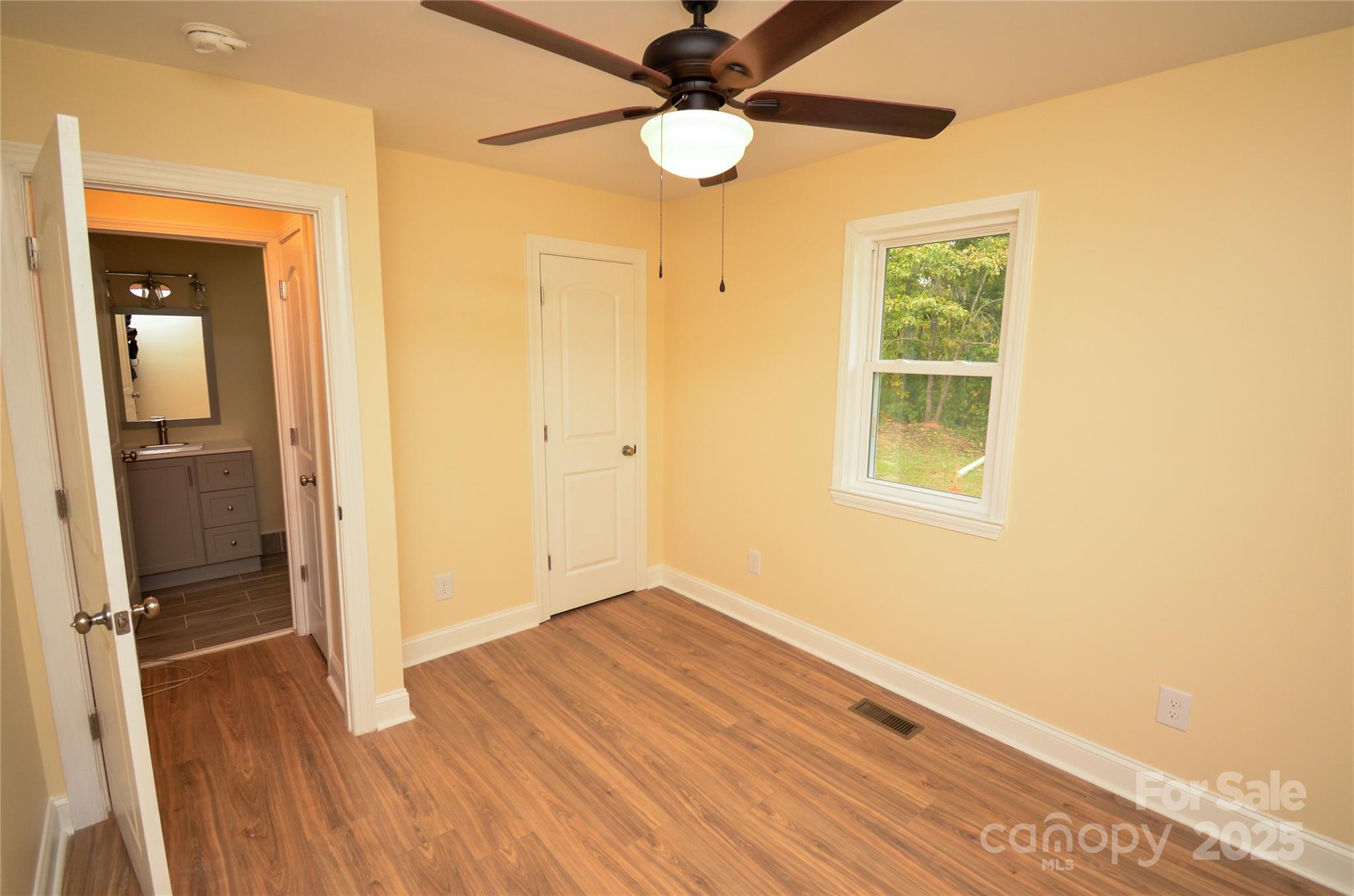 907 Carpenters Grove Church Road Lawndale, NC 28090 - Photo 29 of 33 wooden floor in an empty room with a window