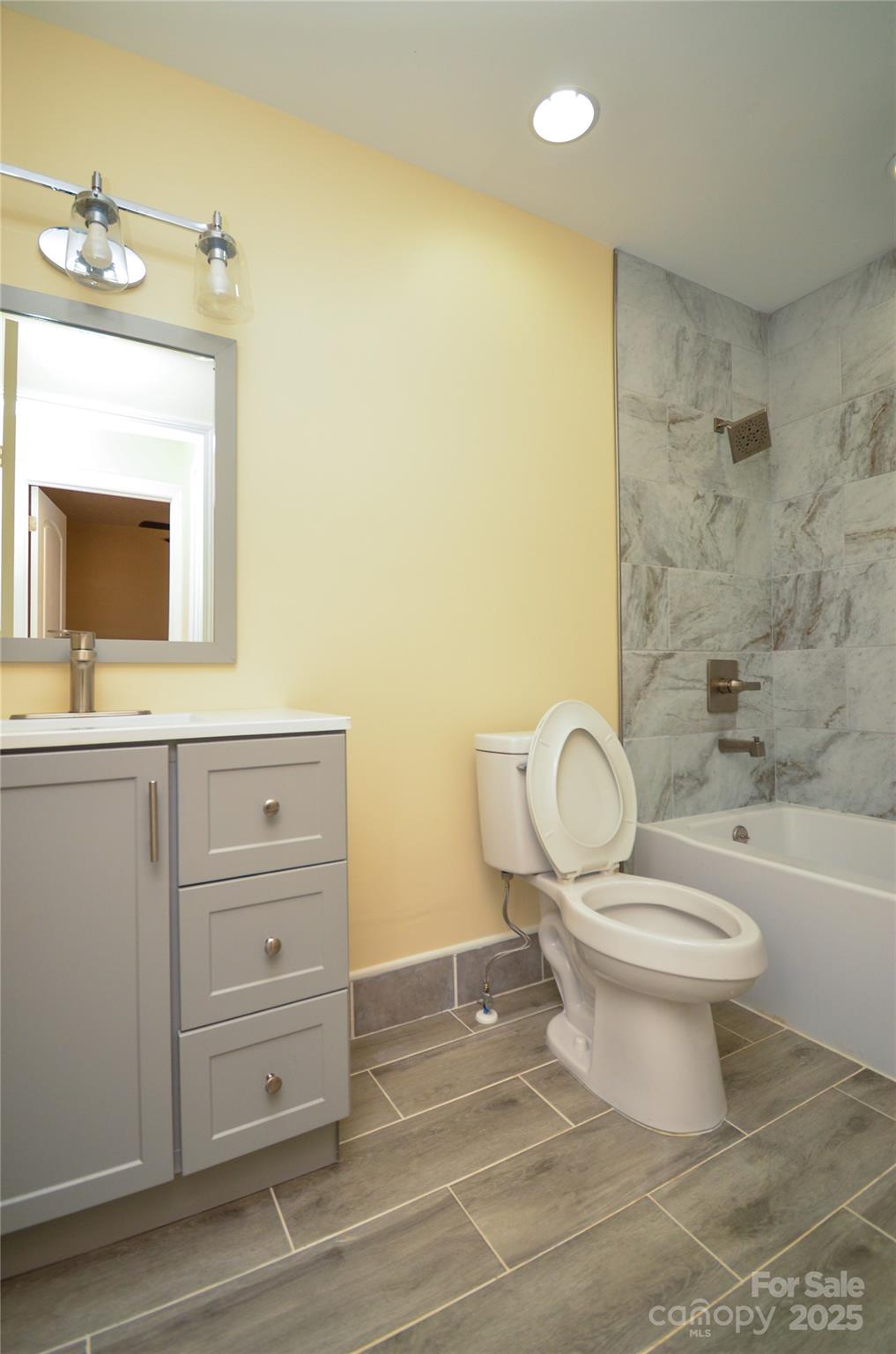 907 Carpenters Grove Church Road Lawndale, NC 28090 - Photo 32 of 33 a bathroom with a toilet a sink a mirror and bathtub