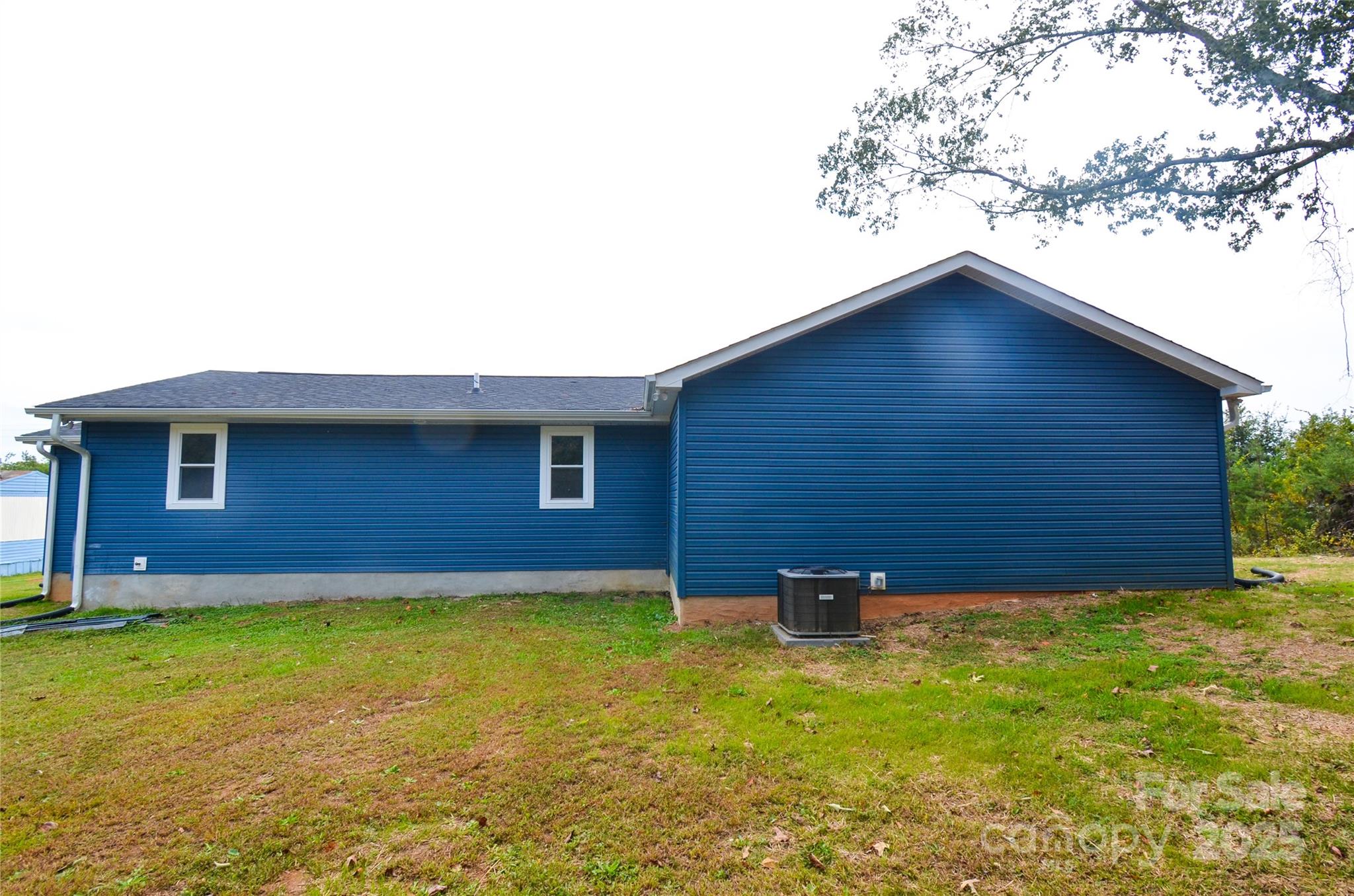 907 Carpenters Grove Church Road Lawndale, NC 28090 - Photo 6 of 33 a backyard of a house with lots of green space