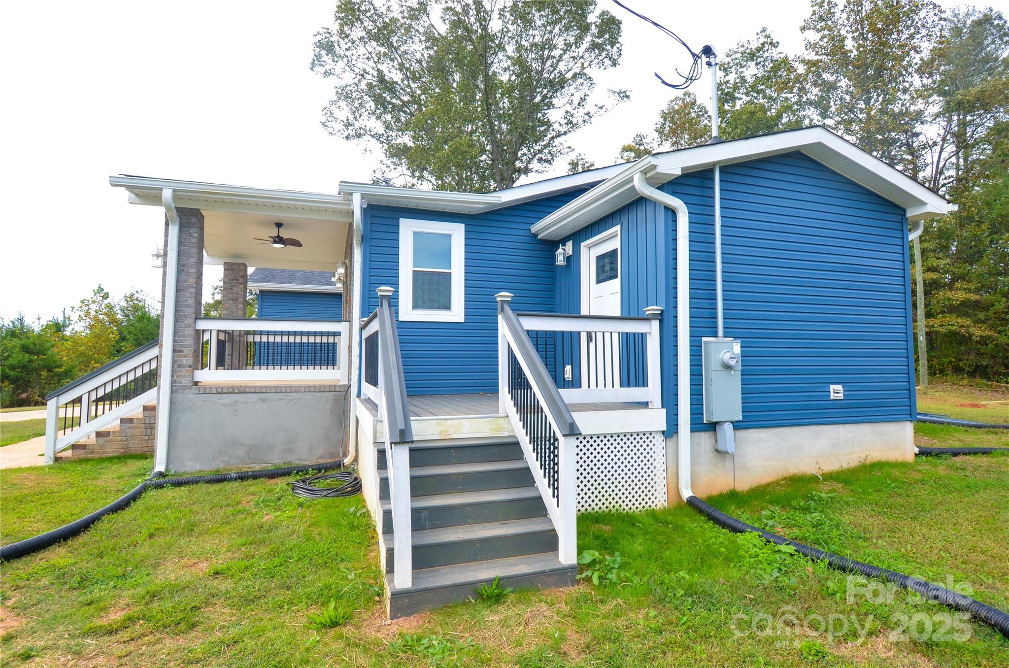 907 Carpenters Grove Church Road Lawndale, NC 28090 - Photo 7 of 33 a view of a house with backyard and a garden