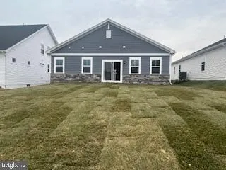 a view of a yard in front of a house