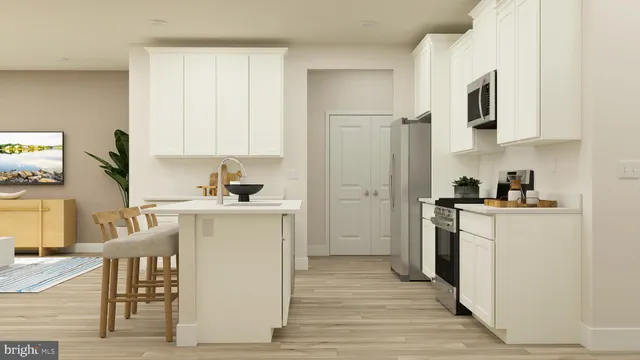 a kitchen with a refrigerator and a stove top oven