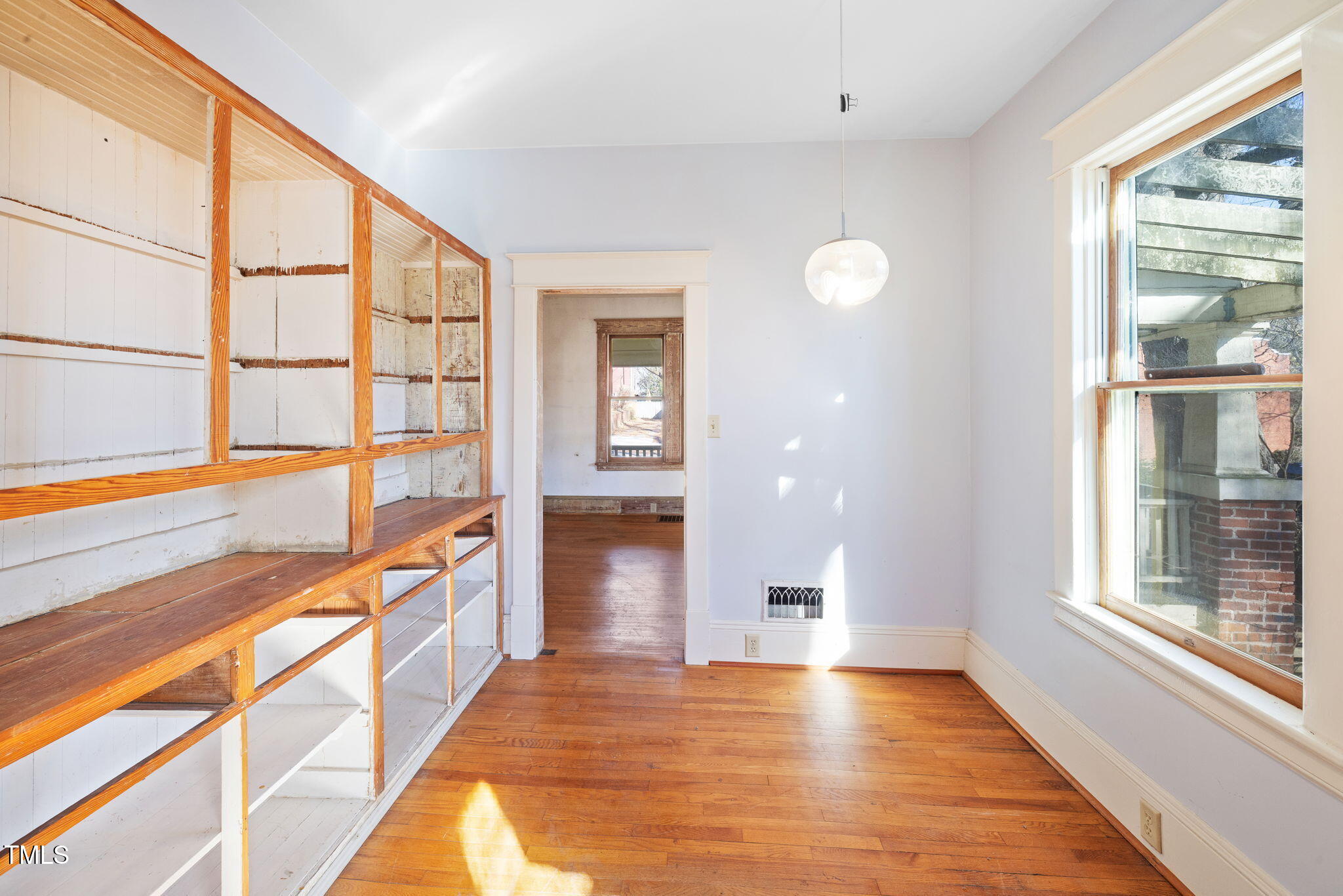 520 Polk Street Raleigh, NC 27604 - Photo 13 of 36 a view of an entryway with wooden floor and windows