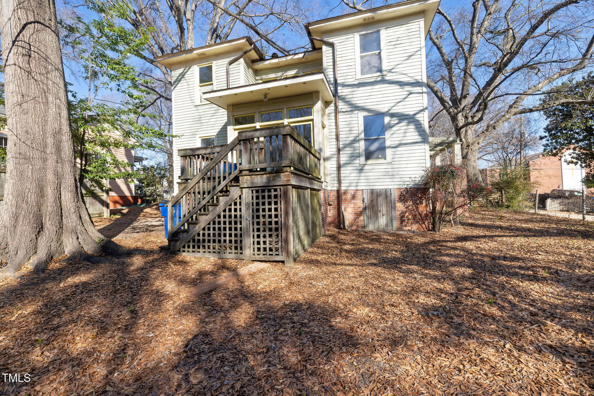 520 Polk Street Raleigh, NC 27604 - Photo 25 of 36 a view of a house with a yard covered with snow