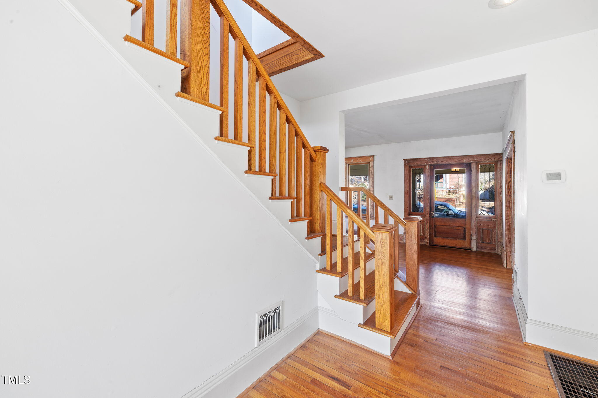 520 Polk Street Raleigh, NC 27604 - Photo 6 of 36 a view of entryway and hall with wooden floor