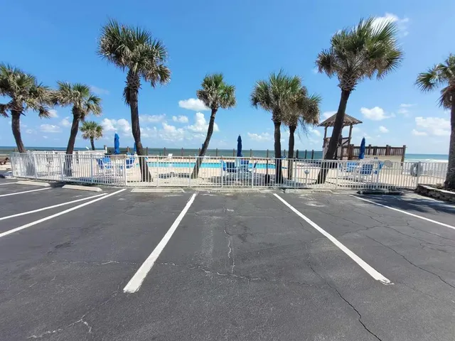 a room with lots of furniture and view kitchen