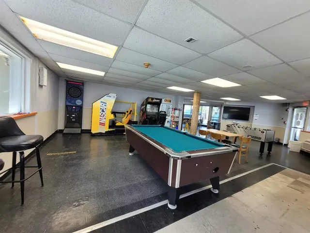 a view of a swimming pool and lounge chairs