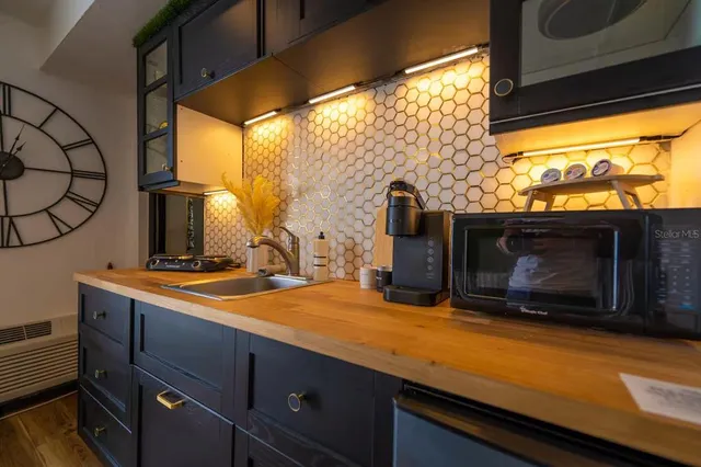 a living room with a couch and a rug