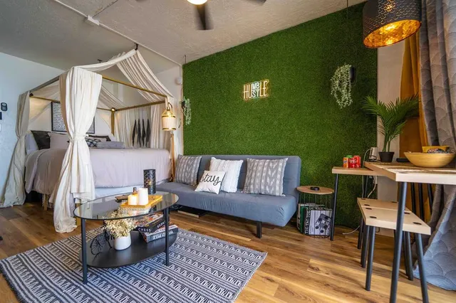 a kitchen with stainless steel appliances granite countertop a refrigerator and a stove