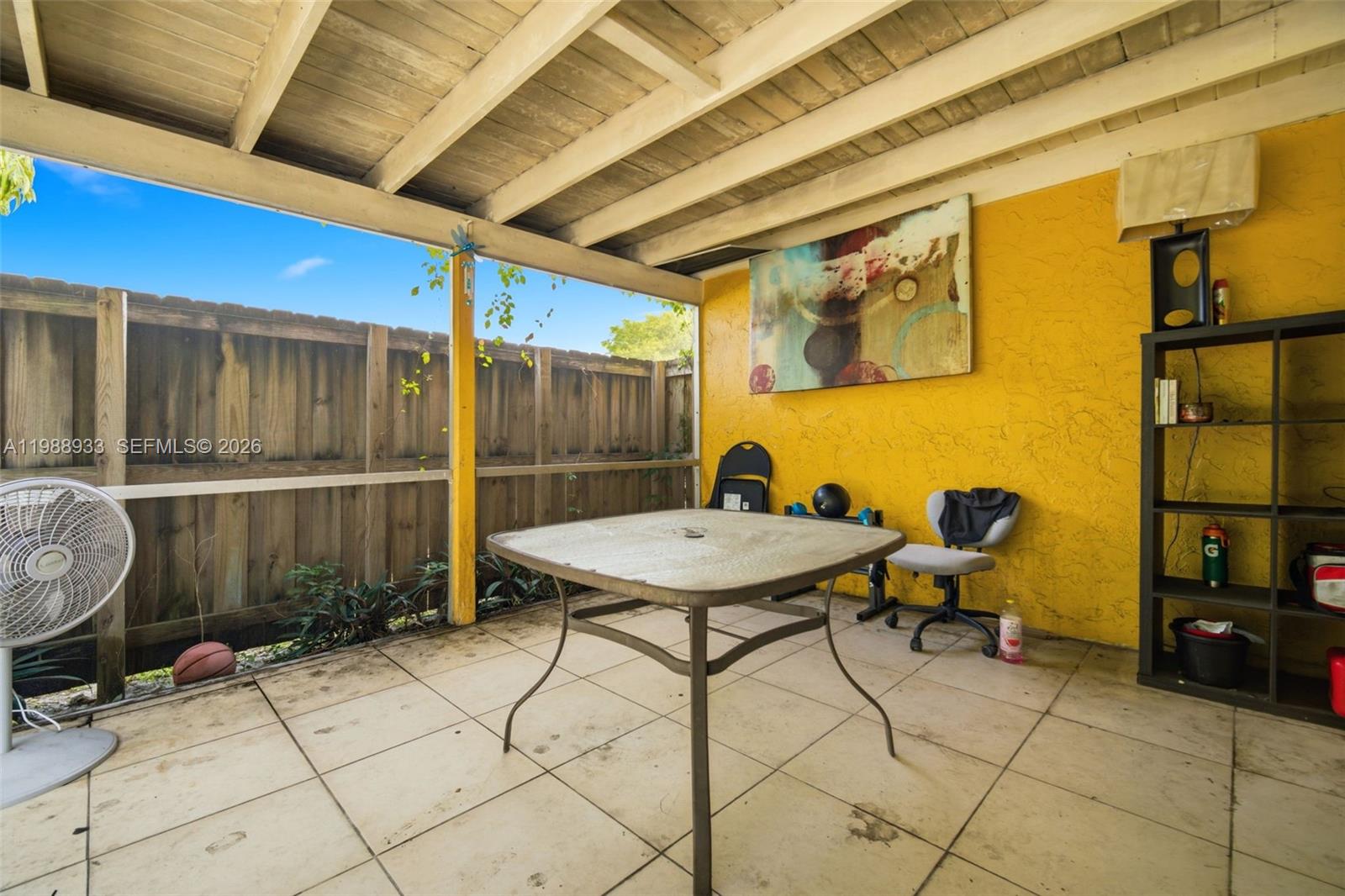 841 Southwest 55th Avenue Margate, FL 33068 - Photo 16 of 26 a backyard of a house with table and chairs
