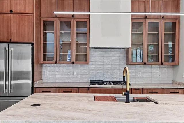 a view of a brick building with a bench in front of house