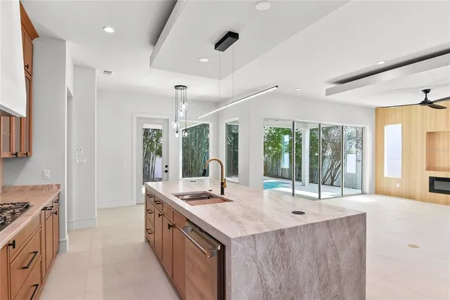 a bathroom with sinks a large window and a sink