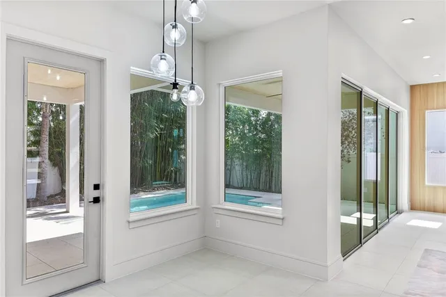 a view of an entryway with front door and windows