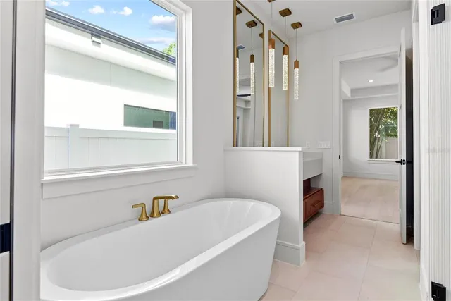 a bathroom with a bathtub and a shower