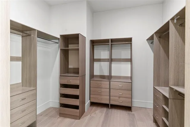 a view of an entryway with wooden floor